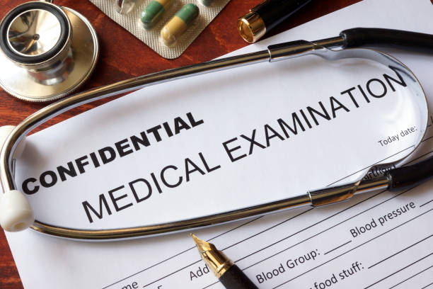 istock Medical confidentiality concept. Medical examination form on a table. 668243924