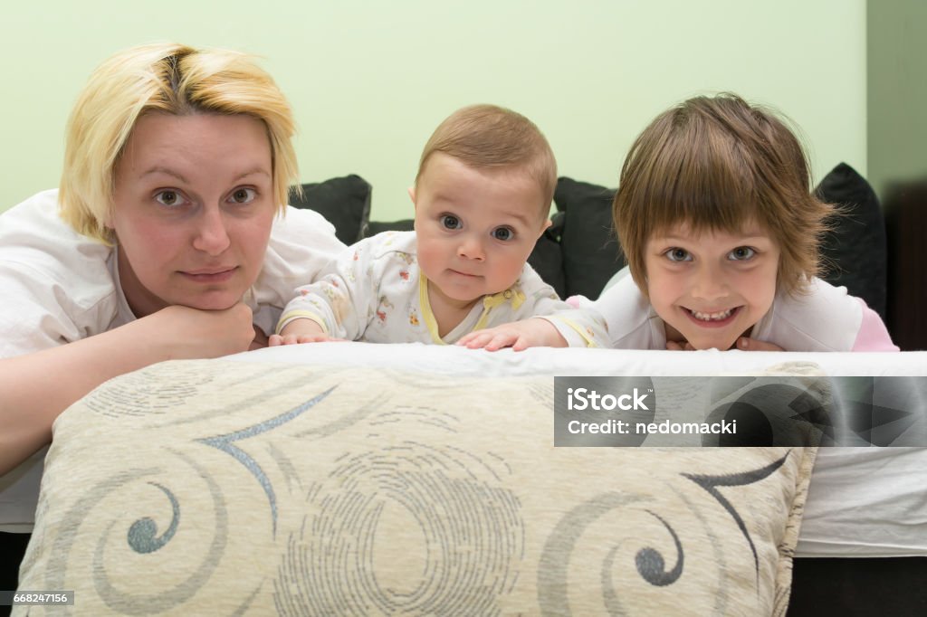 Mother with two kids Mother with two kids. 6-11 Months Stock Photo