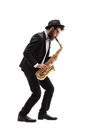 Hombre barbudo tocando un saxofón photo