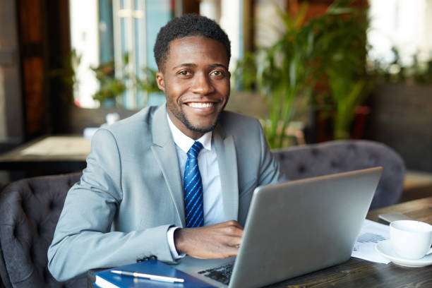 istock Young African Businessman Working with Laptop 668256422