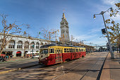 Street car or trollley or muni tram in front of San Francisco Ferry Building in Embarcadero - San Francisco, California, USA