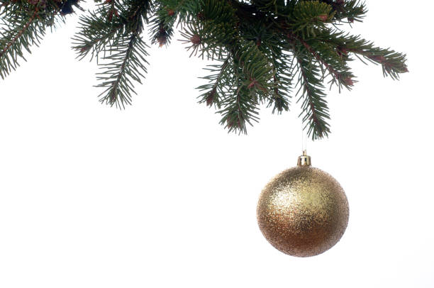 istock Golden Christmas ball on a branch of a New Year tree 668264594