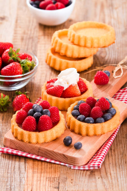 istock Tartlets with forest fruits. 668265120