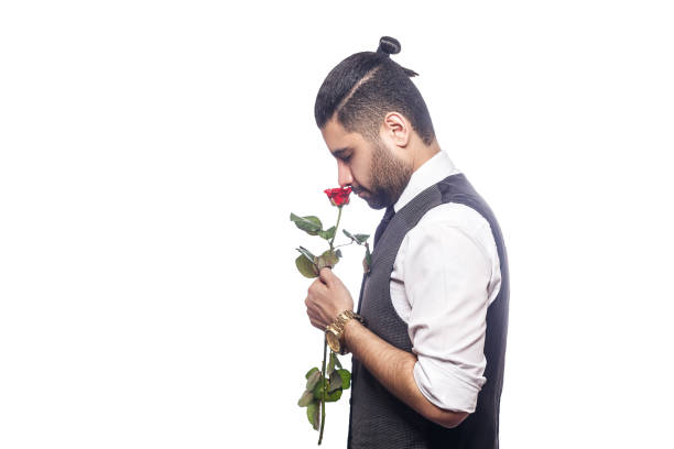 istock Handsome romantic middle eastern happy man with rose flower. 668270960