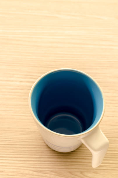 istock Coffee cup on wooden background 668271944