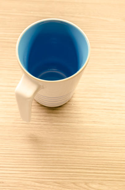 istock Coffee cup on wooden background 668271970