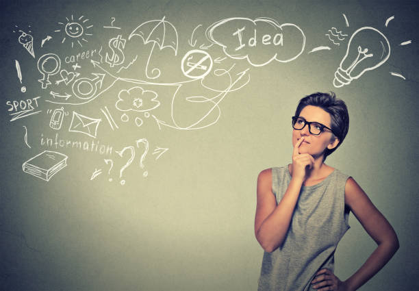 istock happy young woman thinking dreaming has many ideas looking up 668272138