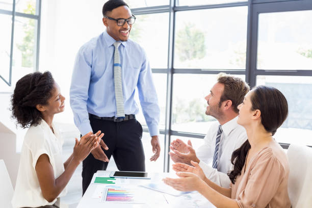 istock Businesspeople discussing a report 668274558