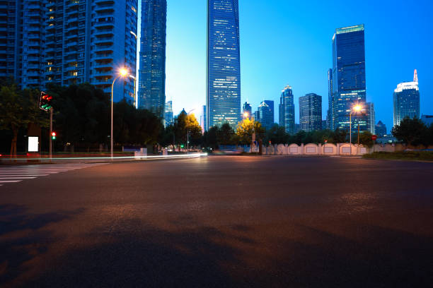 istock Empty road surface with city landmark buildings of night 668275002