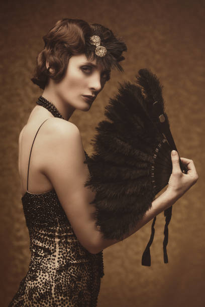 istock Retro woman with feather fan 668275398