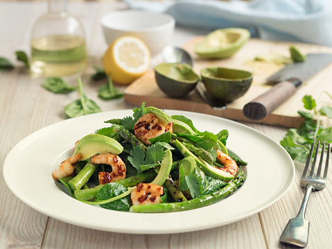Home made freshness spinach,avocado and grilled asparagus salad.adding grilled king prawns with sweet chilli sauce.