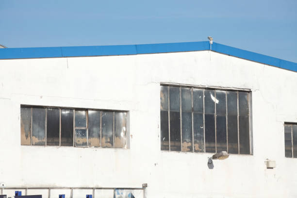 istock Window on an old factory shed 668281890