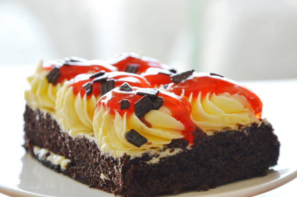 istock chocolate cake topping cream and dressing strawberry sauce 668282706