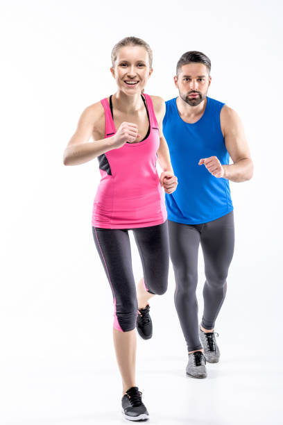istock Man and woman jogging 668285790