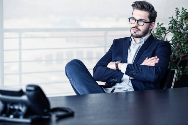 istock Young entrepreneur behind his desk 668286540