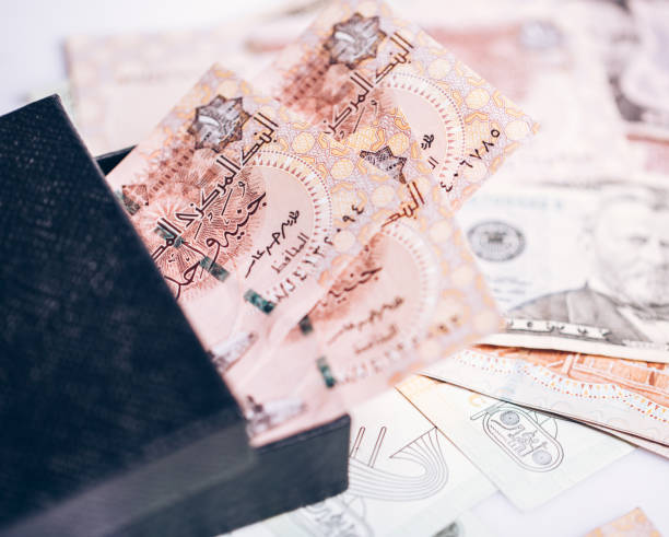 istock Egyptian pound with dollars banknote. 668296744
