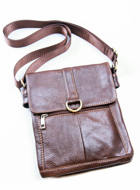 istock Small elegant red men's leather bag shoulder strap,Isolated. 668297274