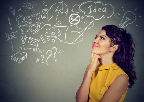 istock woman thinking dreaming has many ideas looking up at plan 668299504