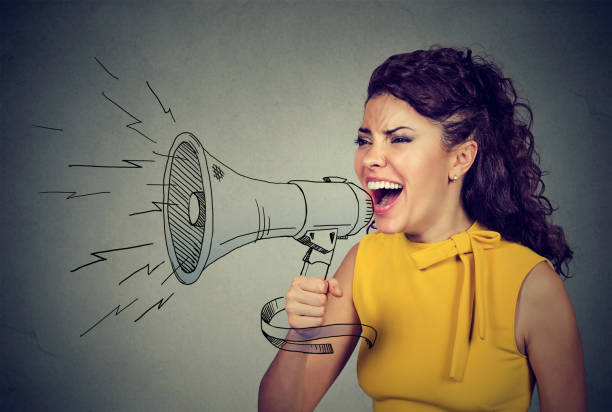 istock Woman screaming in megaphone 668299830