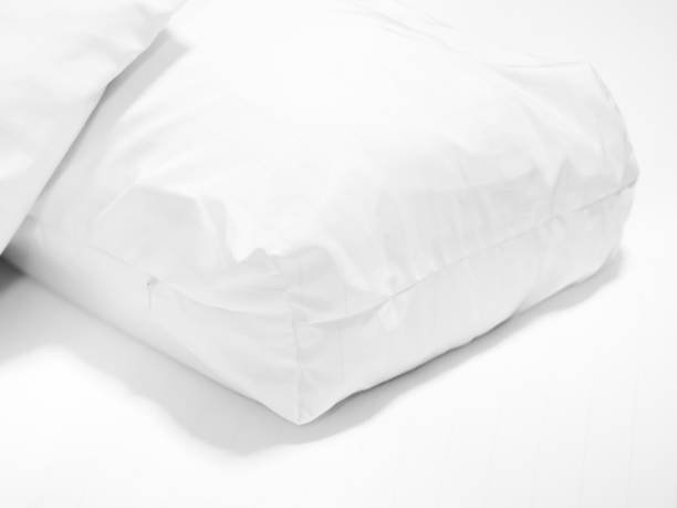 istock Closeup of white pillow on bed in bedroom. 668303310
