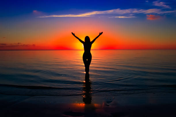 istock Woman silhouette on water 668303362