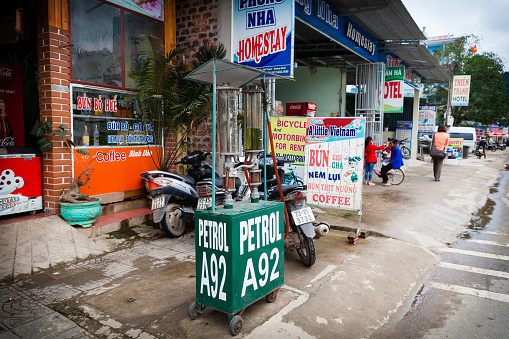 Phong Nha, Vietnam - March 8 2017: operated gasoline station on a sidewalk is the most popular way to buy gasoline on rural areas.