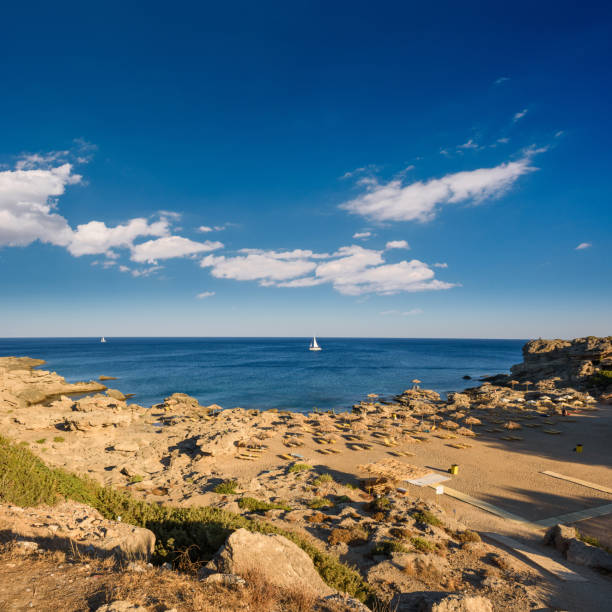 Kokkina beach on Rhodes with sailboat out at the sea, Greece
