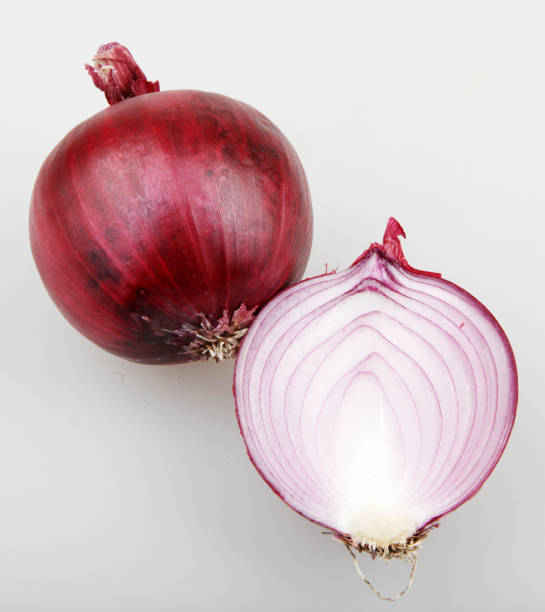 istock red onion isolated on white background 668327050