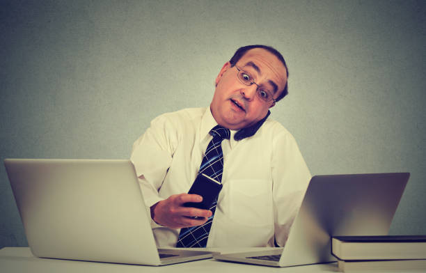 istock middle aged business man working at his office desk 668329946