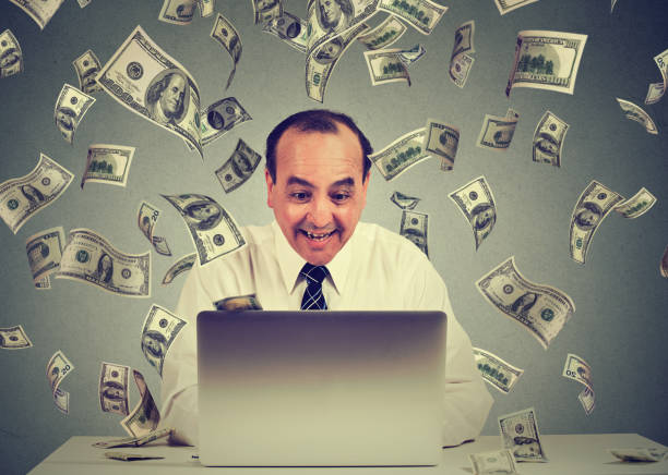 istock Middle aged business man using a laptop building online business 668330084