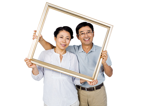 Older asian couple with frame on white background
