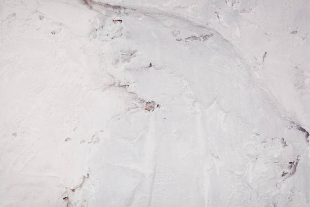 istock abstract background of a concrete wall. White old plaster 668331220