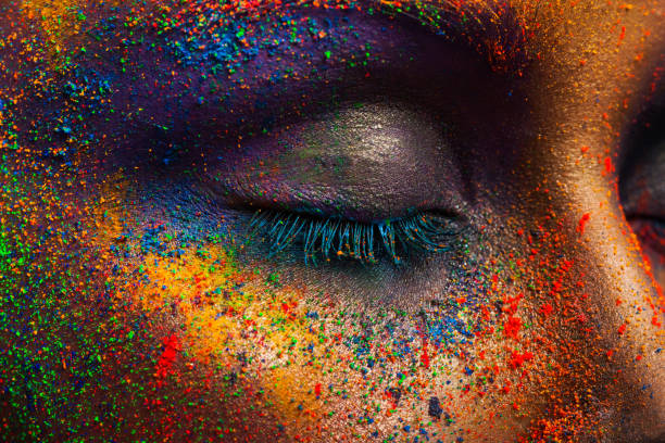 istock Eye of model with colorful art make-up, close-up 668340142