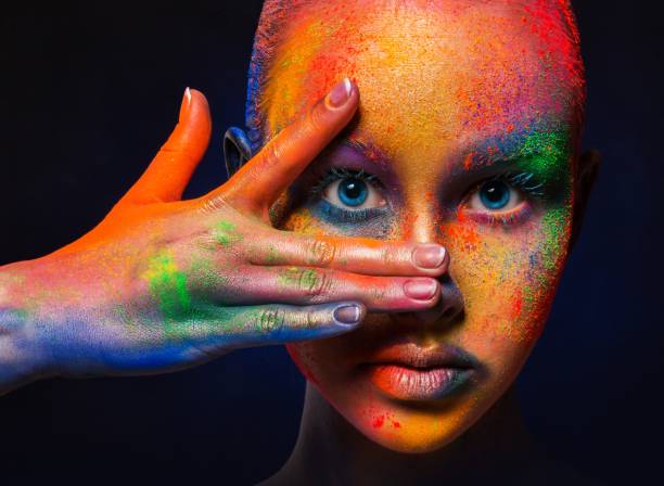 istock Model with colorful art make-up, close-up 668340686