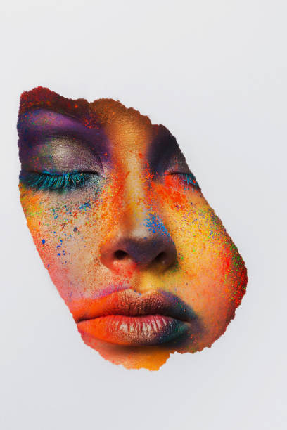 istock Face of model with colorful art make-up, close-up 668340842
