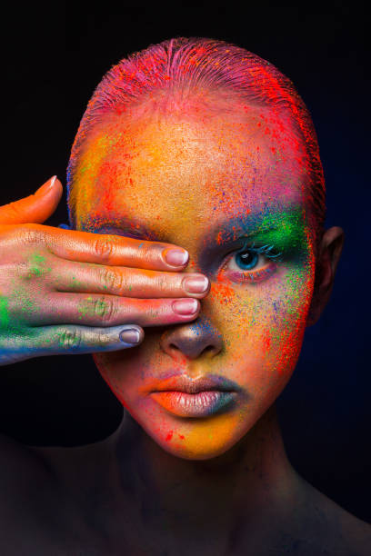 istock Model with colorful art make-up, close-up 668340960