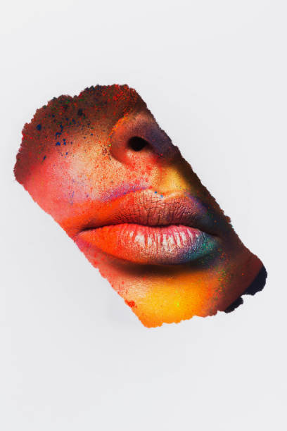 istock Lips of model with colorful art make-up, close-up 668340974