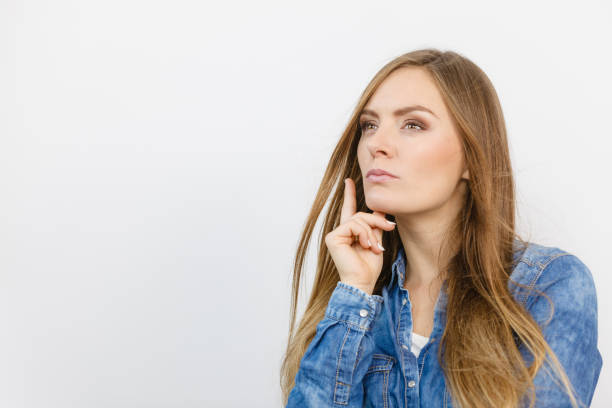 istock Pensively girl with blue shirt. 668343484