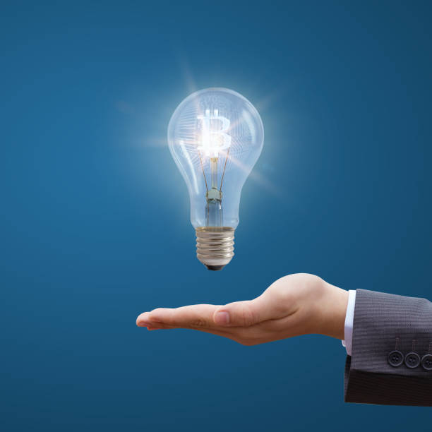 istock Burning bit coin as a concept of new idea . 668344462