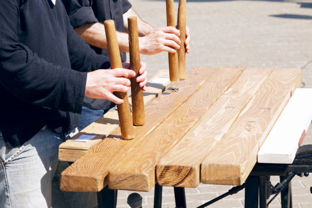 Txalaparta outdoors, in a sunny day. Txalaparta outdoors, in a sunny day. The txalaparta is a percussion musical instrument, a specialized Basque music device made of wood or stone. comunidad autonoma del pais vasco stock pictures, royalty-free photos & images