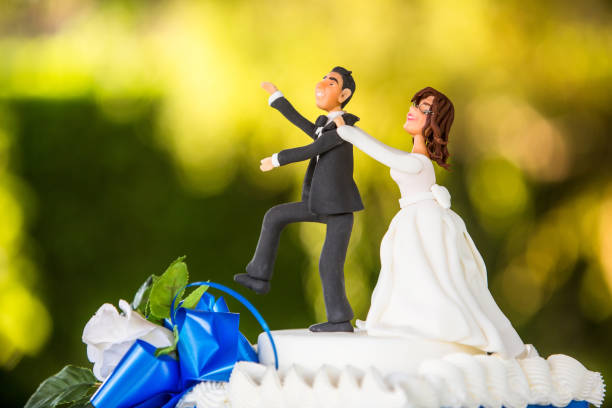 istock beautiful wedding cake with topper 668353964