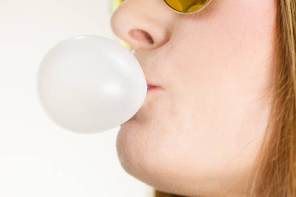istock Woman doing bubble with chewing gum 668354062