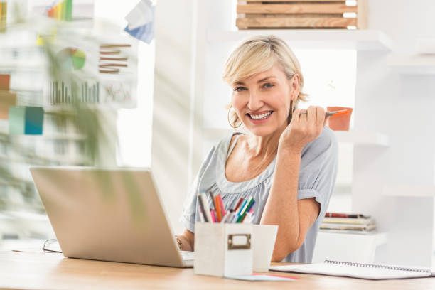 istock Smiling businesswoman looking at the camera 668361336