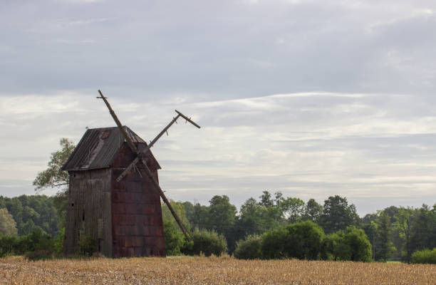 istock Kawnice, Poland. Old ruined windmill on the field. 668367350