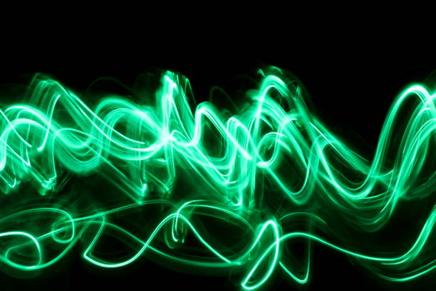 istock Green Light Painting Photography on a black background 668367872