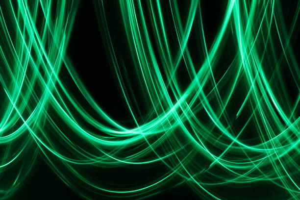 istock Green Light Painting Photography on a black background 668367902