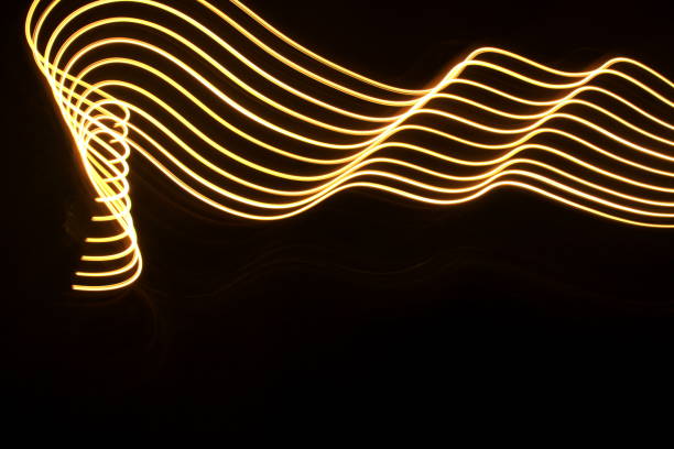 istock Gold Light Painting Photography on a black background 668368080