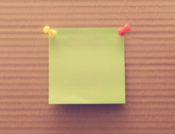 istock blank reminder note nailed to a wooden plank or wall 668374970