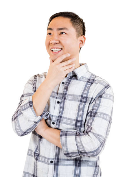 istock Happy young man with hand on chin 668378344
