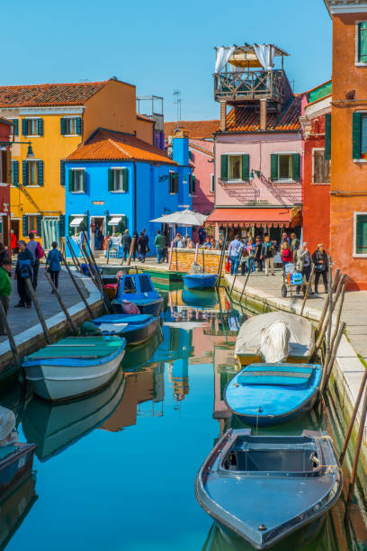 Burano, Italy - March 29, 2014: Colourful house beside along with canal in Burano island, Italy